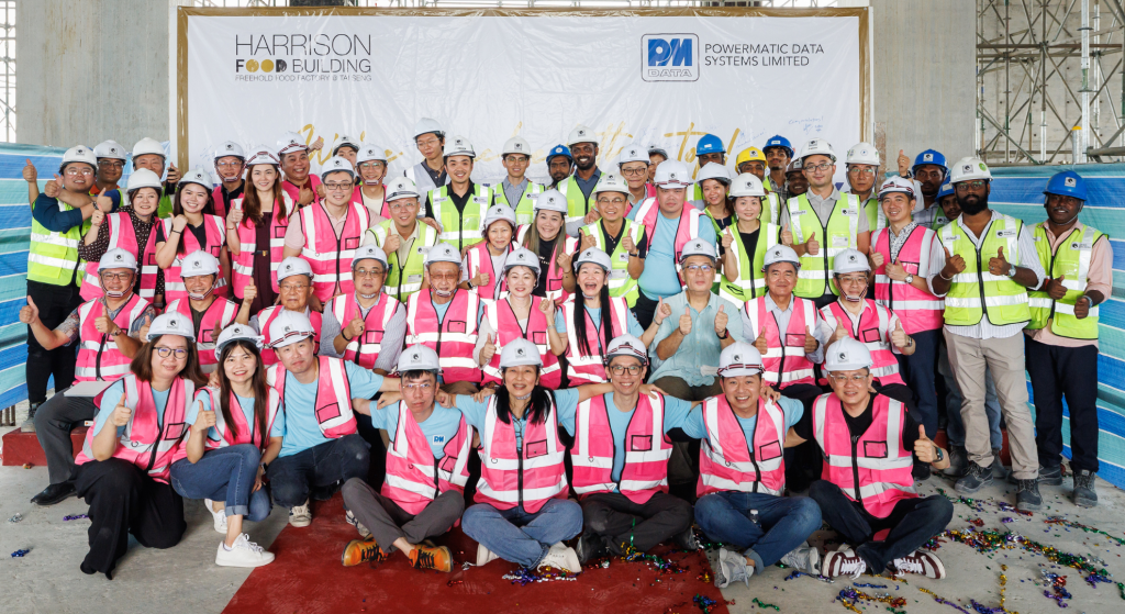 Commemorative group photo at Harrison Food Building topping-out ceremony